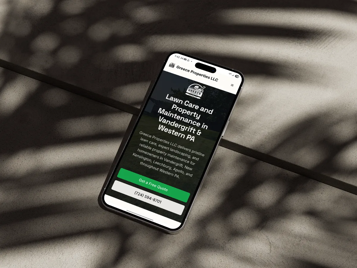 Website built for Greece Properties LLC in Vandergrift, Pennsylvania, shown on a phone.